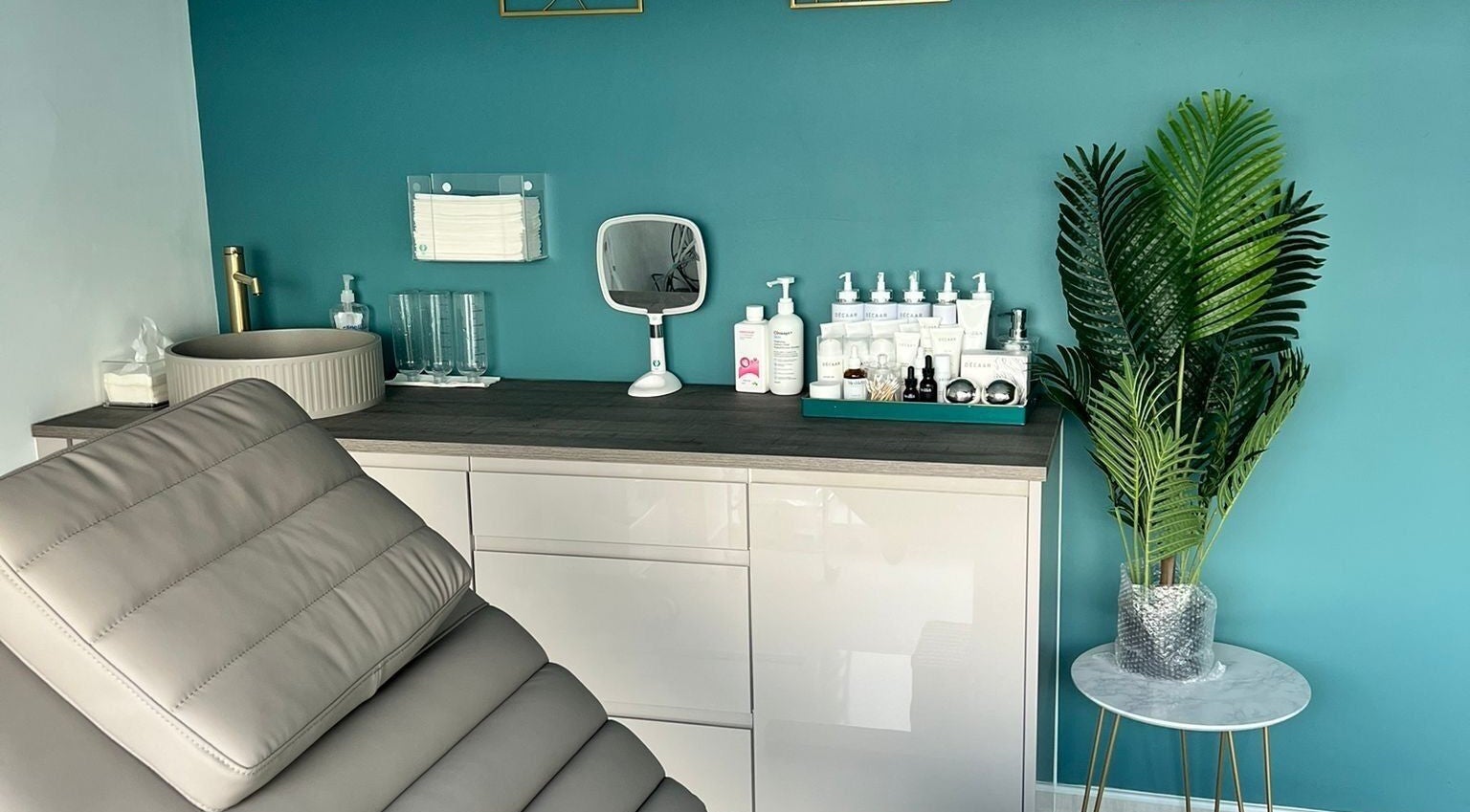 Modern treatment room at NR Derma Aesthetics in Bicester, England, GB showcasing a relaxing, stylish ambiance.