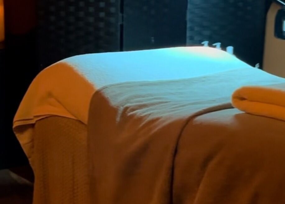 Spa bed with warm lighting at Face:it, Borve, Scotland, GB, creating a calming and relaxing atmosphere.