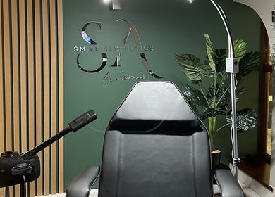 Treatment chair at Smile Aesthetics by Jamie in Cardiff, Wales, GB. Modern design with lush green decor.