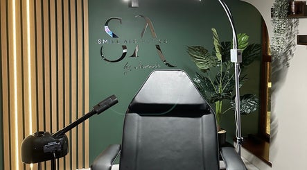 Treatment chair at Smile Aesthetics by Jamie in Cardiff, Wales, GB. Modern design with lush green decor.