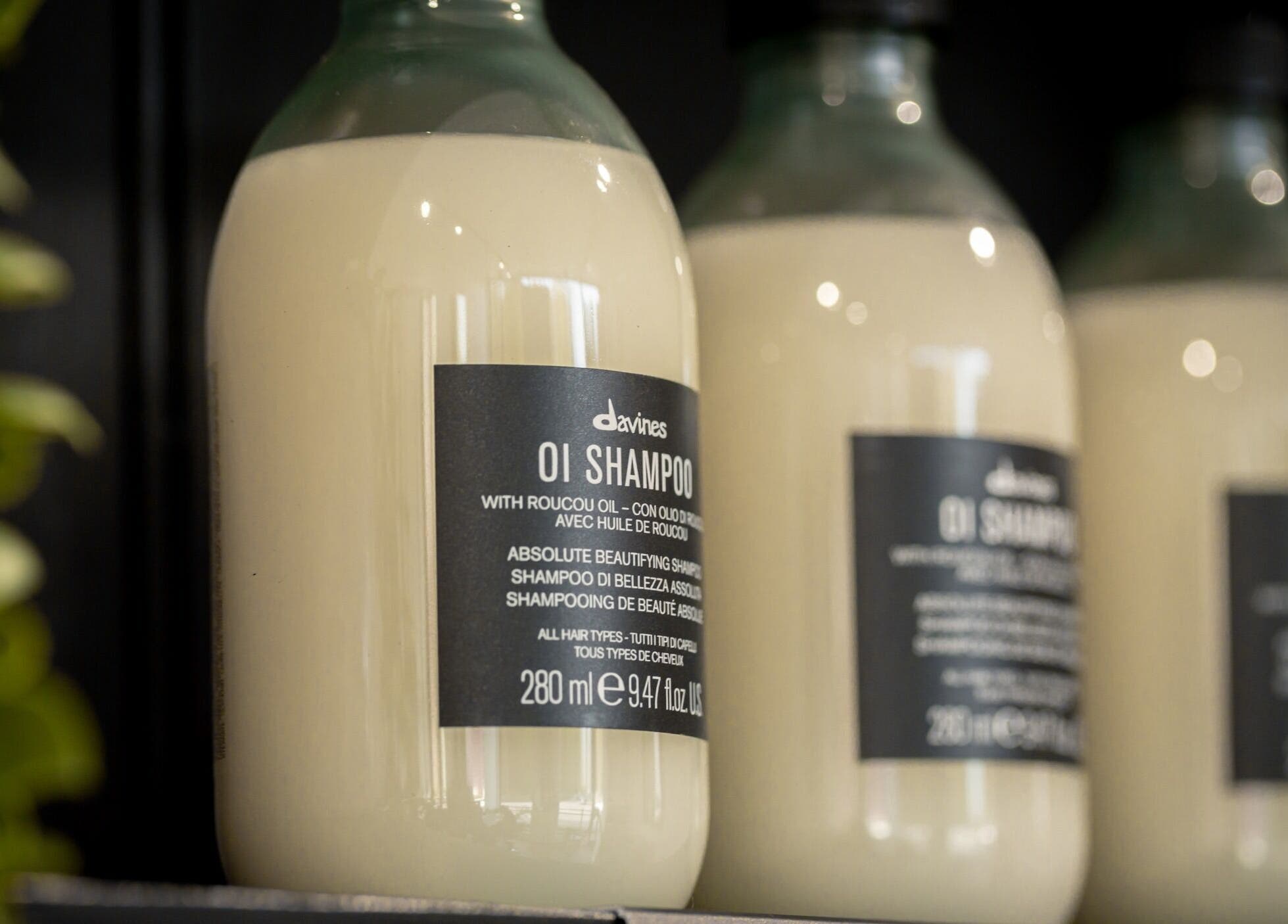Davines OI Shampoo bottles at Rose and Rogue, Sevenoaks, England, GB. Luxurious hair care on display.