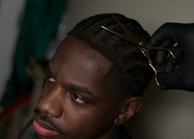 Close-up of hair styling with scissors at LM CUTZ, London, England, GB.