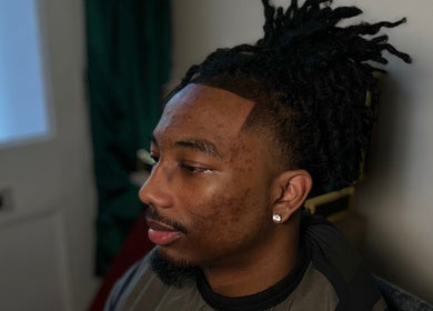 Close-up of a stylish haircut at LM CUTZ, London, England, GB, showcasing detailed grooming.