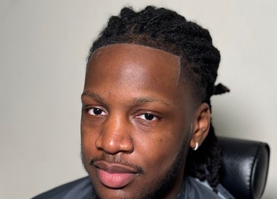 Man with fresh hairstyle at LM CUTZ, London, England, GB showcasing expert grooming services.