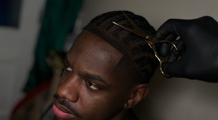 Hair stylist shaping haircut at LM CUTZ, London, England, GB for a sleek finish.