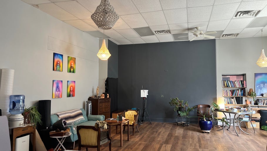 Relaxing lounge area at Beauty Culture Avondale in Chicago, Illinois, US with cozy seating and artistic decor.