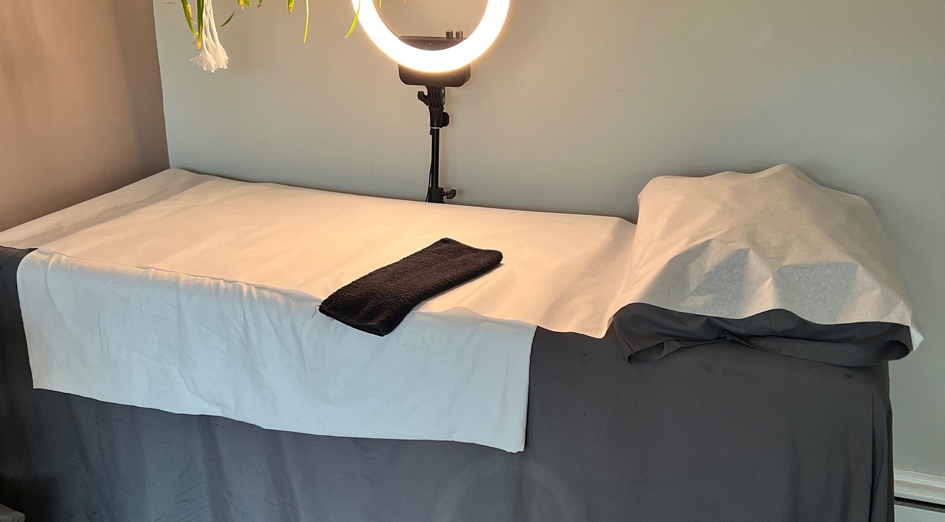 Calm treatment bed at Beauty Culture (Lincolnwood Home Office), Lincolnwood, Illinois, US, ready for clients.