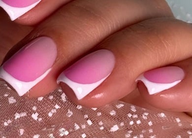 Elegant French manicure with pink tips at Somayeh BEAUTY, Dubai, Dubai, AE.