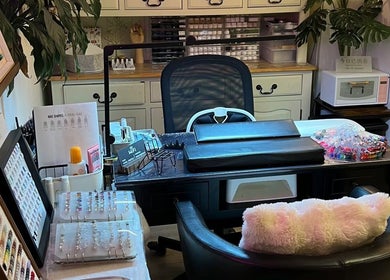Interior of Jenn Gel Nail Studio, Rowley Regis, showcasing nail art supplies and comfy seating.