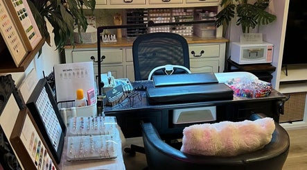 Interior of Jenn Gel Nail Studio, Rowley Regis, showcasing nail art supplies and comfy seating.
