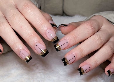 Stylish gold and black nail design at Jenn Gel Nail Studio, Rowley Regis, England, GB.