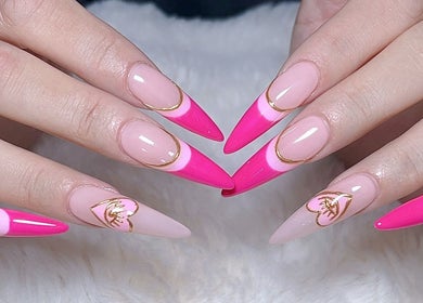 Stylish pink gel nails with gold accents at Jenn Gel Nail Studio, Rowley Regis, England, GB.