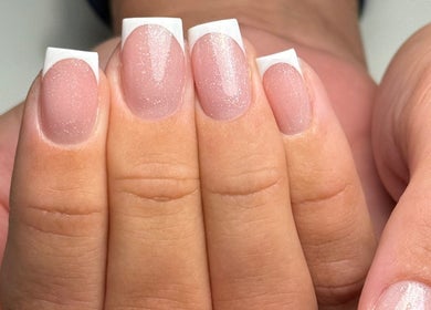 Elegant French manicure with glitter by Heather Connor at Elevate, Linlithgow, Scotland, GB.