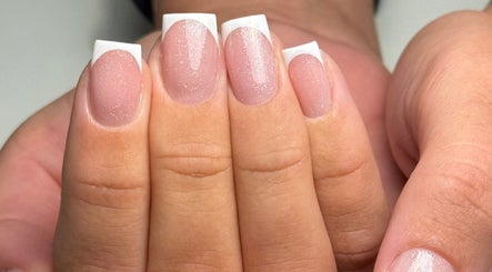 Elegant French manicure with glitter by Heather Connor at Elevate, Linlithgow, Scotland, GB.