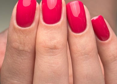 Bright red manicured nails by Heather Connor at Elevate, Linlithgow, Scotland, GB.