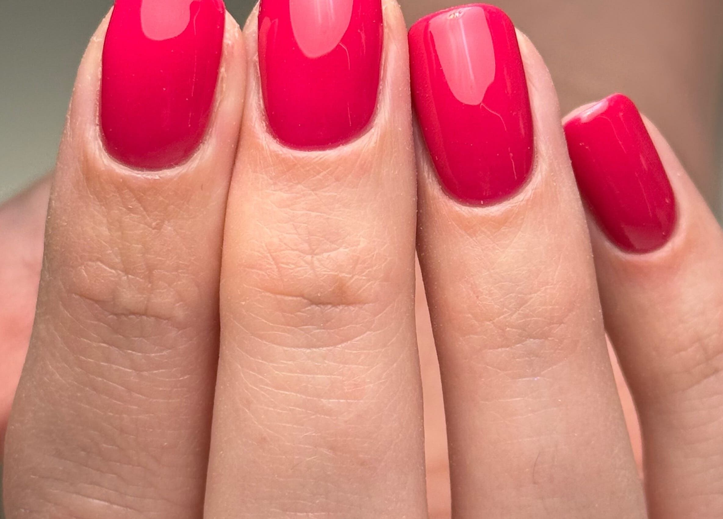Bright red nail polish by Heather Connor at Elevate in Linlithgow, Scotland, GB offers stunning beauty.