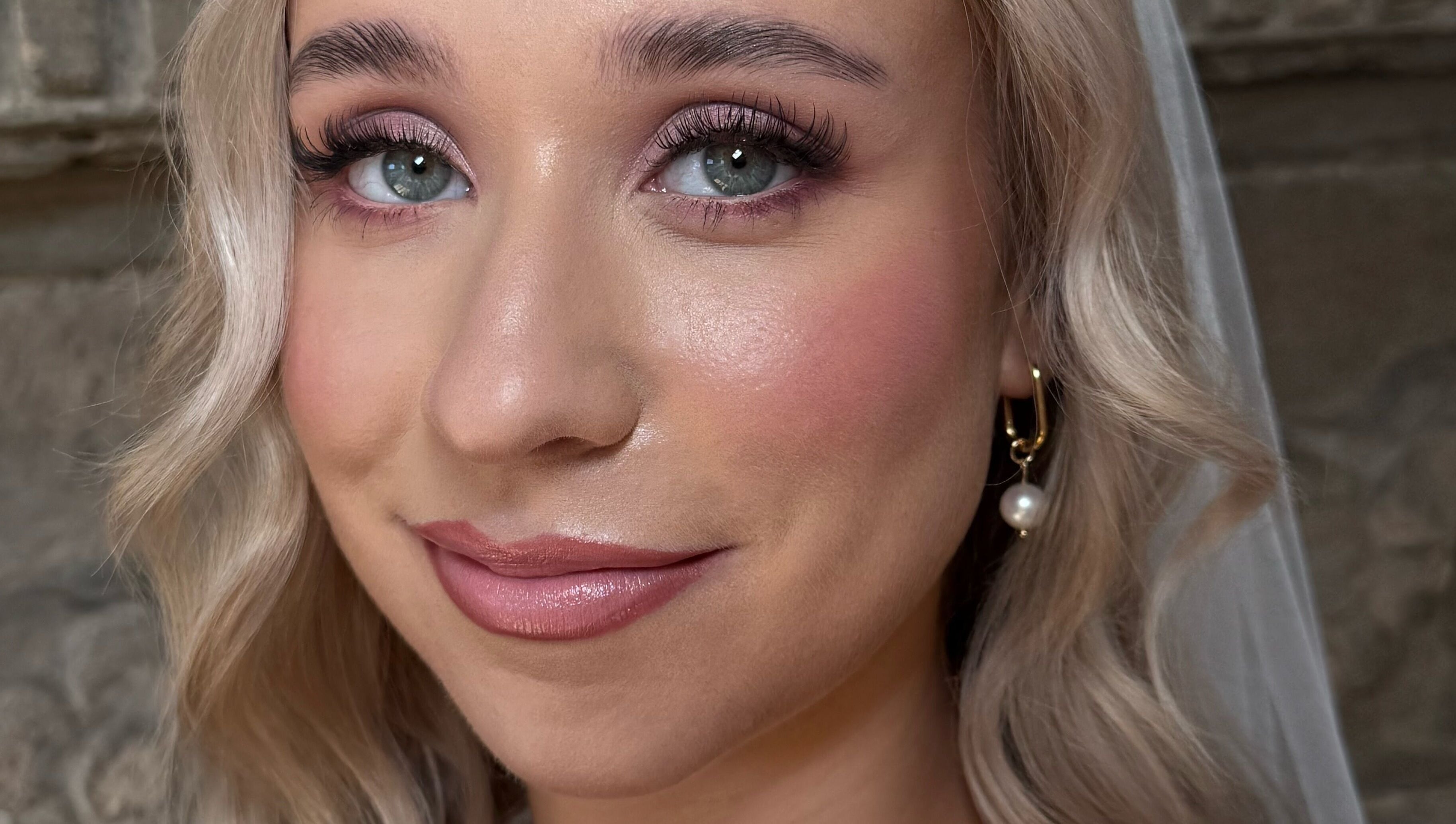Bridal makeup by Heather Connor at Elevate, Linlithgow, Scotland, GB. Flawless complexion with soft curls.