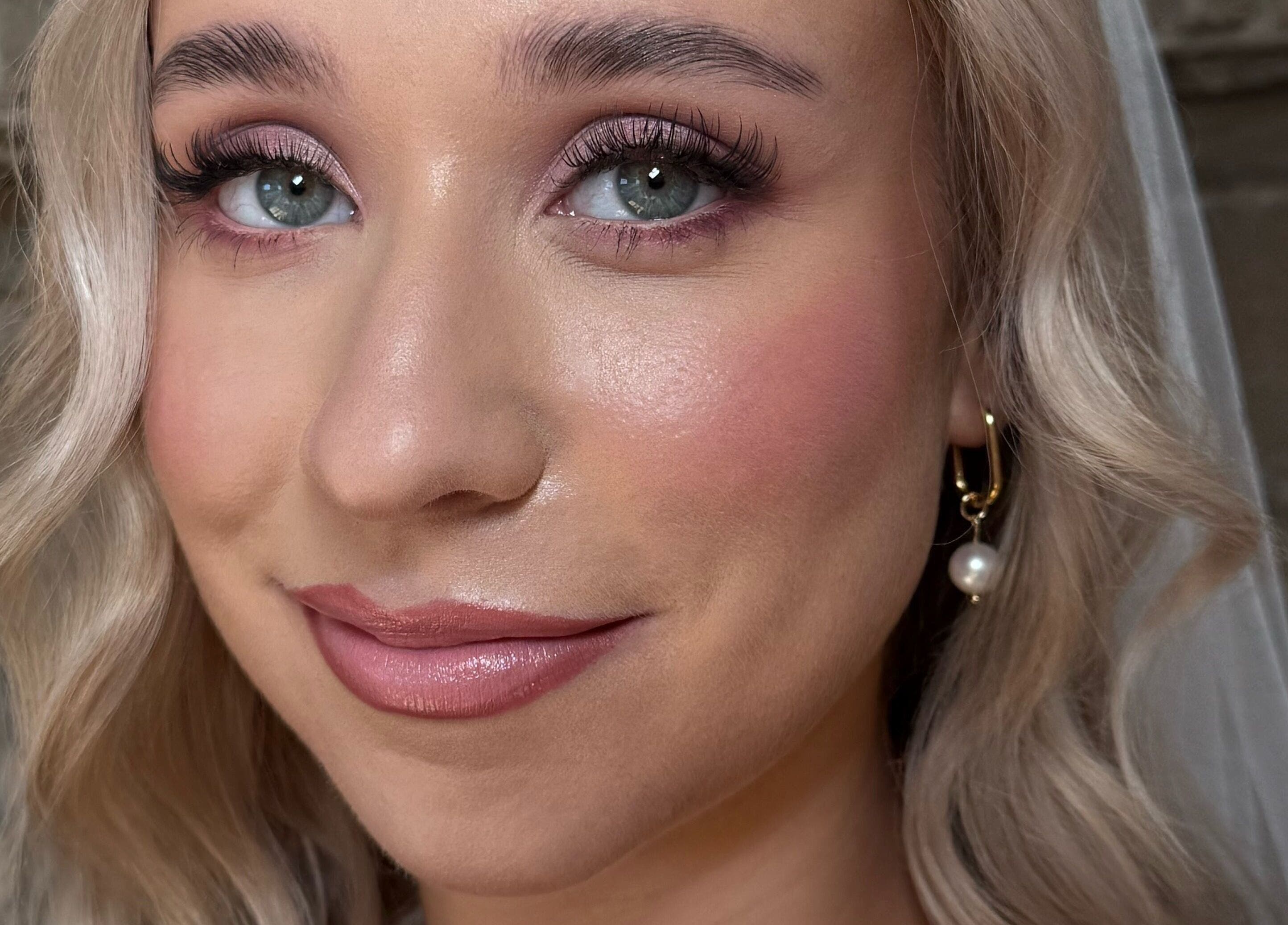 Bridal makeup by Heather Connor at Elevate, Linlithgow, Scotland, GB. Flawless complexion with soft curls.