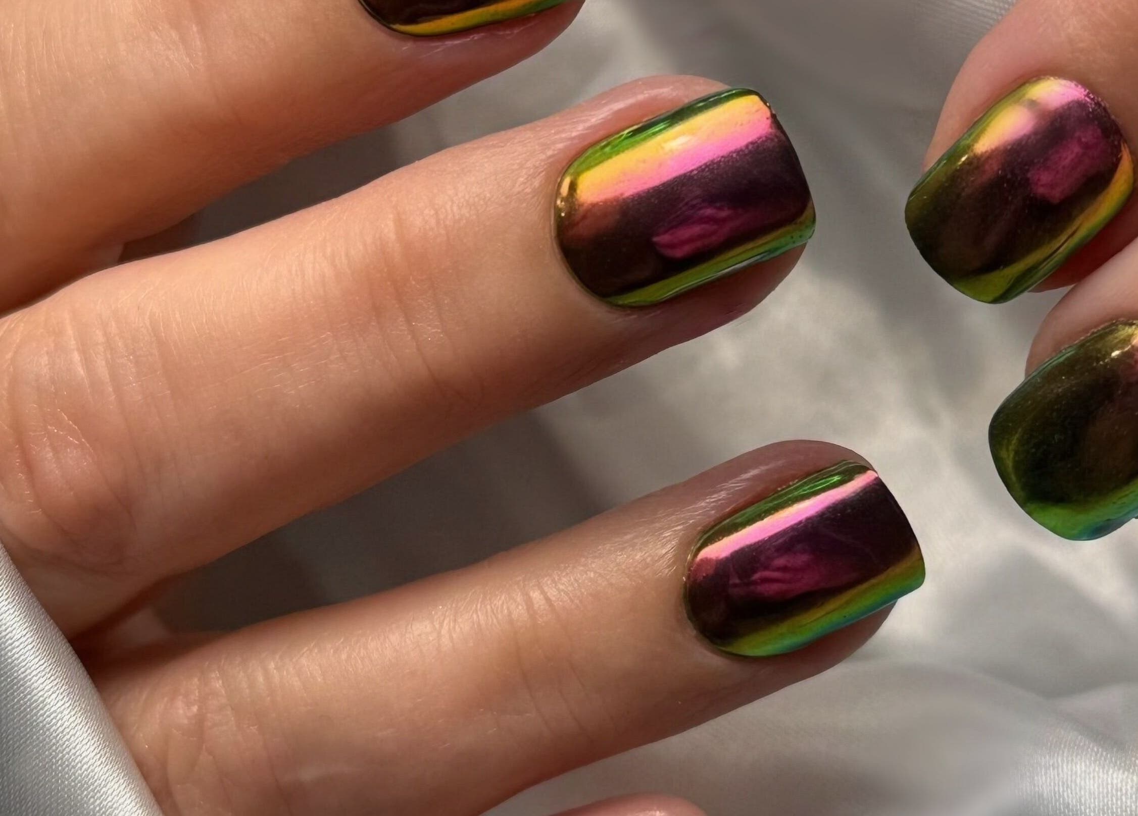 Shimmering iridescent nails by Heather Connor at Elevate, Linlithgow, Scotland, GB on a silk background.