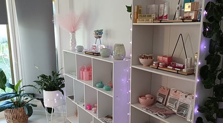 Elegant product shelves at Lash Artistry by RK, Buttaba, New South Wales, AU, showcasing beauty essentials.