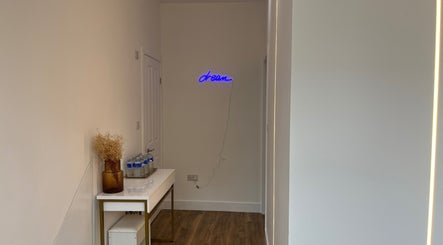 Modern interior of Nav’s Beauty, London, England, GB with a sign reading 'dream'.