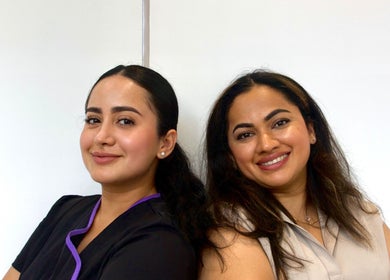 Friendly team members at Nav’s Beauty, London, England, GB, showcasing professional care.