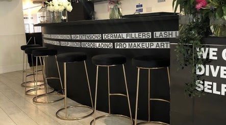 Elegant interior of Navs Beauty Clapham, London, England, GB with sleek bar seating and stylish decor.