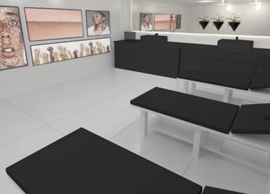 Modern treatment room at Navs Beauty Clapham, London, England, GB with sleek decor and stylish artwork.