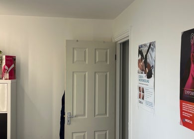 Interior view of treatment room at Navs Beauty Clapham, adorned with decor and posters, London, England, GB.
