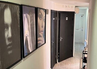 Hallway with art at Navs Beauty Clapham, London, England, GB, showcasing elegant decor.