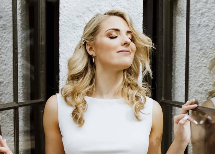Woman enjoying a moment of reflection at Oulik Vroulik, Cape Town, Western Cape, ZA.