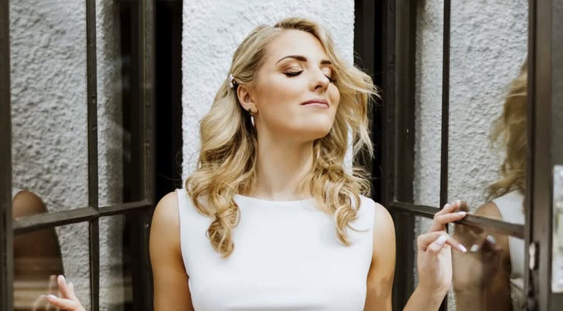 Woman enjoying a moment of reflection at Oulik Vroulik, Cape Town, Western Cape, ZA.