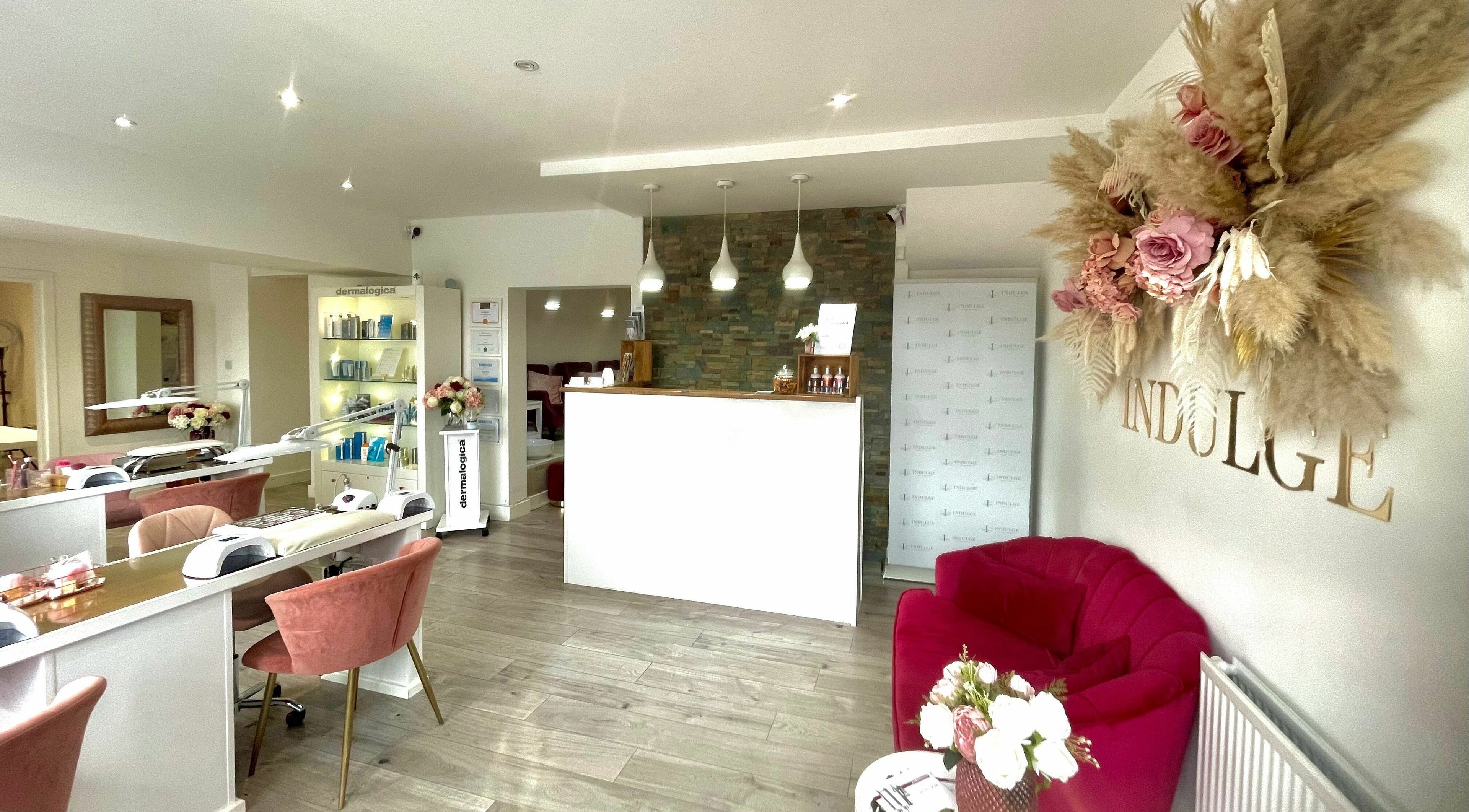 Chic interior of Indulge beauty venue in Leeds, England, GB with modern decor and floral accents.
