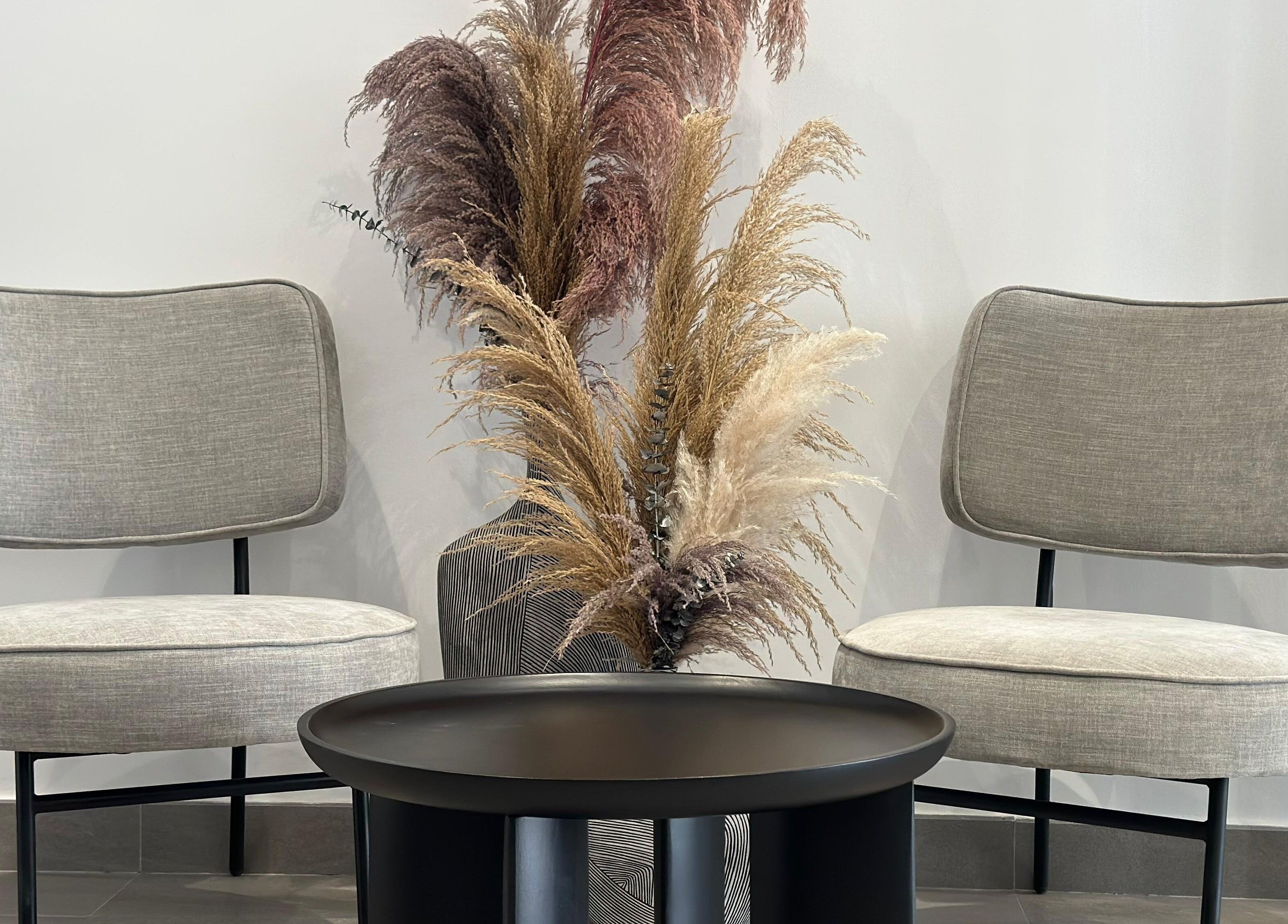 Chic seating area at Always On Show Hair Studio, Dubai, قرية جميرا الدائرية, AE with stylish chairs and decor.