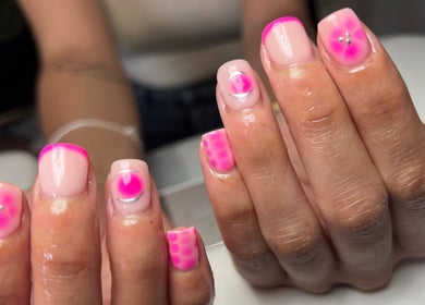Colorful pink nail art at Pops Beauty Studio in Gwent, Wales, GB. Showcasing creative and vibrant designs.