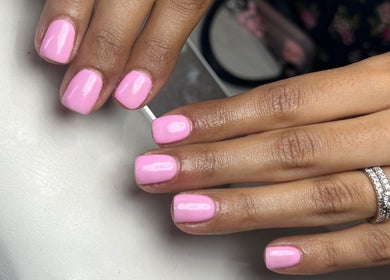 Close-up of pink manicured nails at Pops Beauty Studio, Gwent, Wales, GB showcasing elegant nail art.