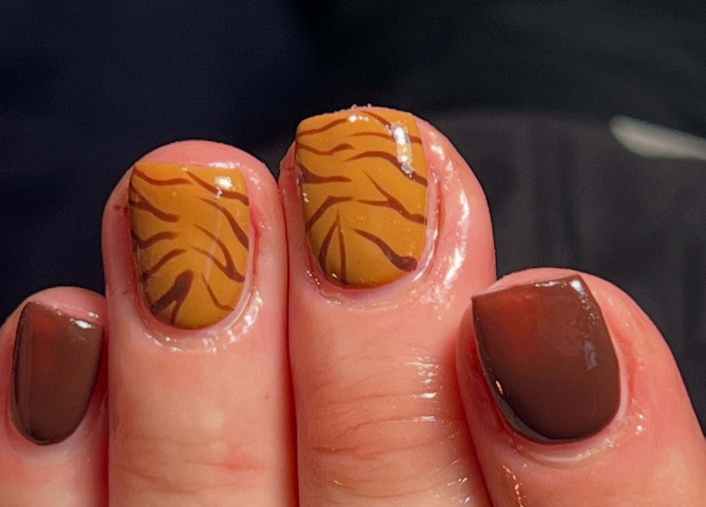 Stylish brown and orange nail art at PopsBeautyStudio, Bettws, Newport, Wales, GB.