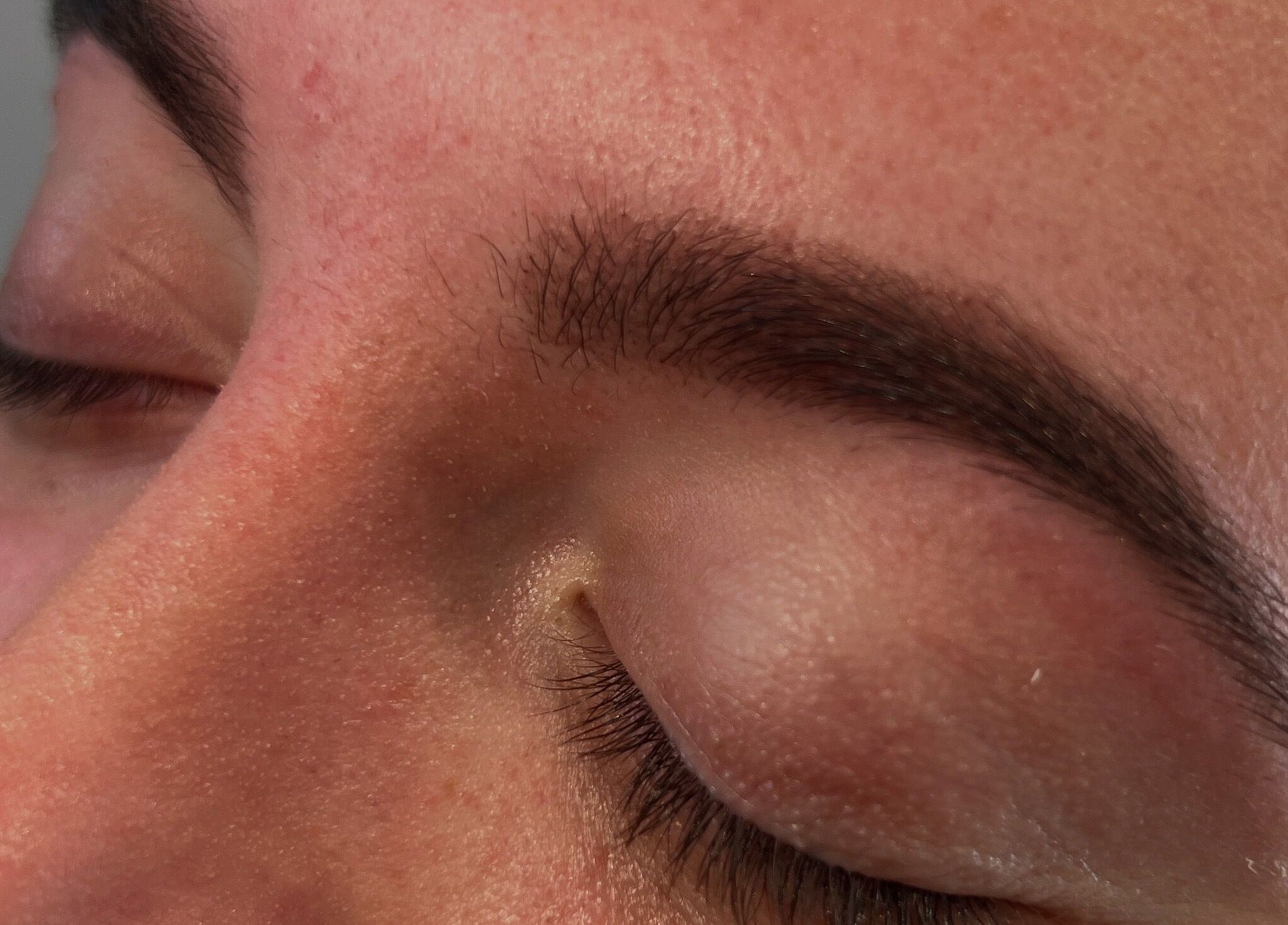 Close-up of well-groomed eyebrows at PopsBeautyStudio in Bettws, Newport, Wales, GB.