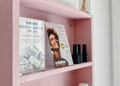 Spatique product display with skincare serums on a pink shelf in Cape Town, Western Cape, ZA.