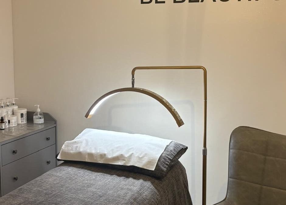 Calm and inviting treatment room at One to One Beauty, Huntingdon, England, GB, featuring a massage table.