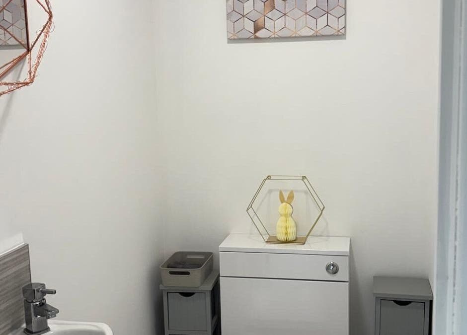 Elegant restroom at One to One Beauty in Huntingdon, England, GB, featuring stylish decor and calming ambiance.