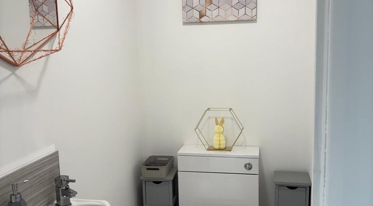 Elegant restroom at One to One Beauty in Huntingdon, England, GB, featuring stylish decor and calming ambiance.