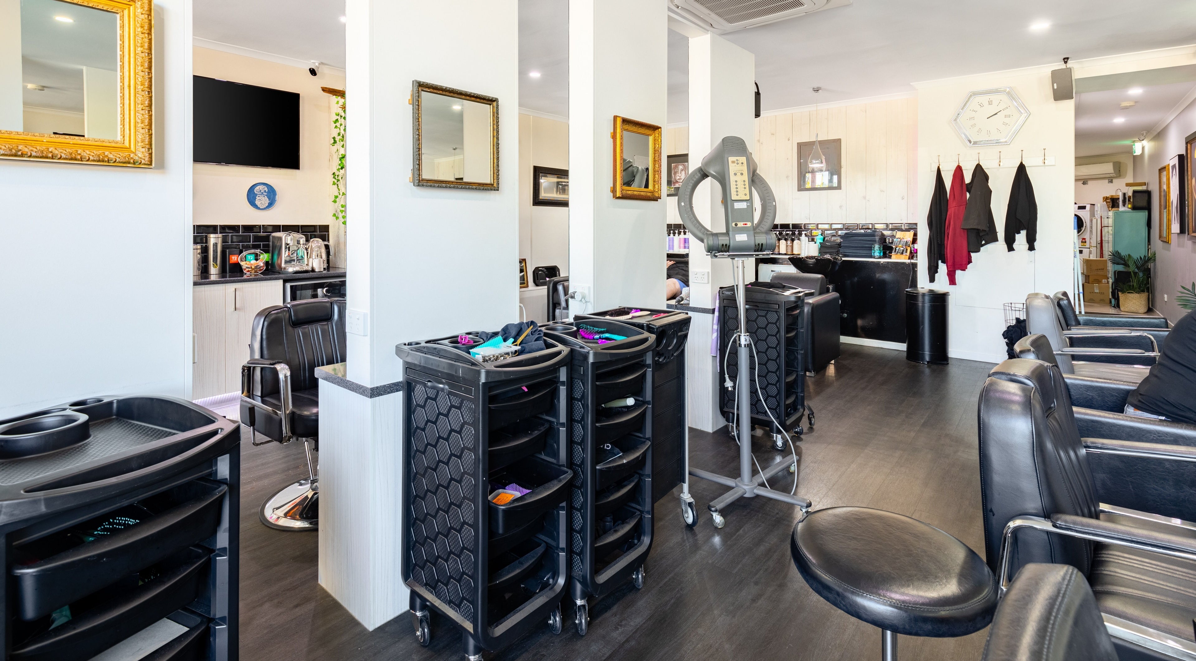 Interior view of Marcia Gibsons Hair Fashions, Everton Hills, QLD, AU showcasing chic salon setup.