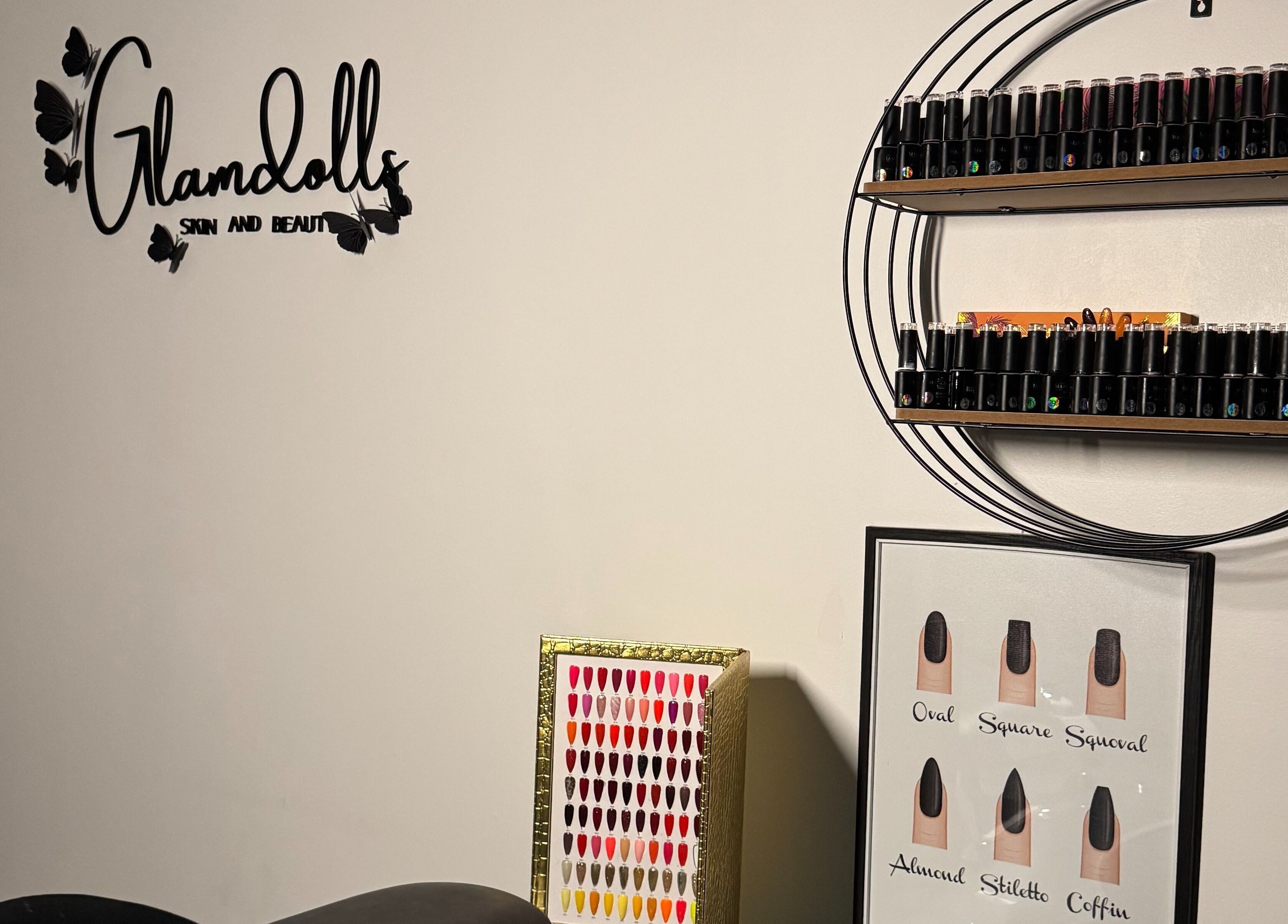 Glamdolls salon in Dublin, County Dublin, IE with nail polish display and logo on wall.