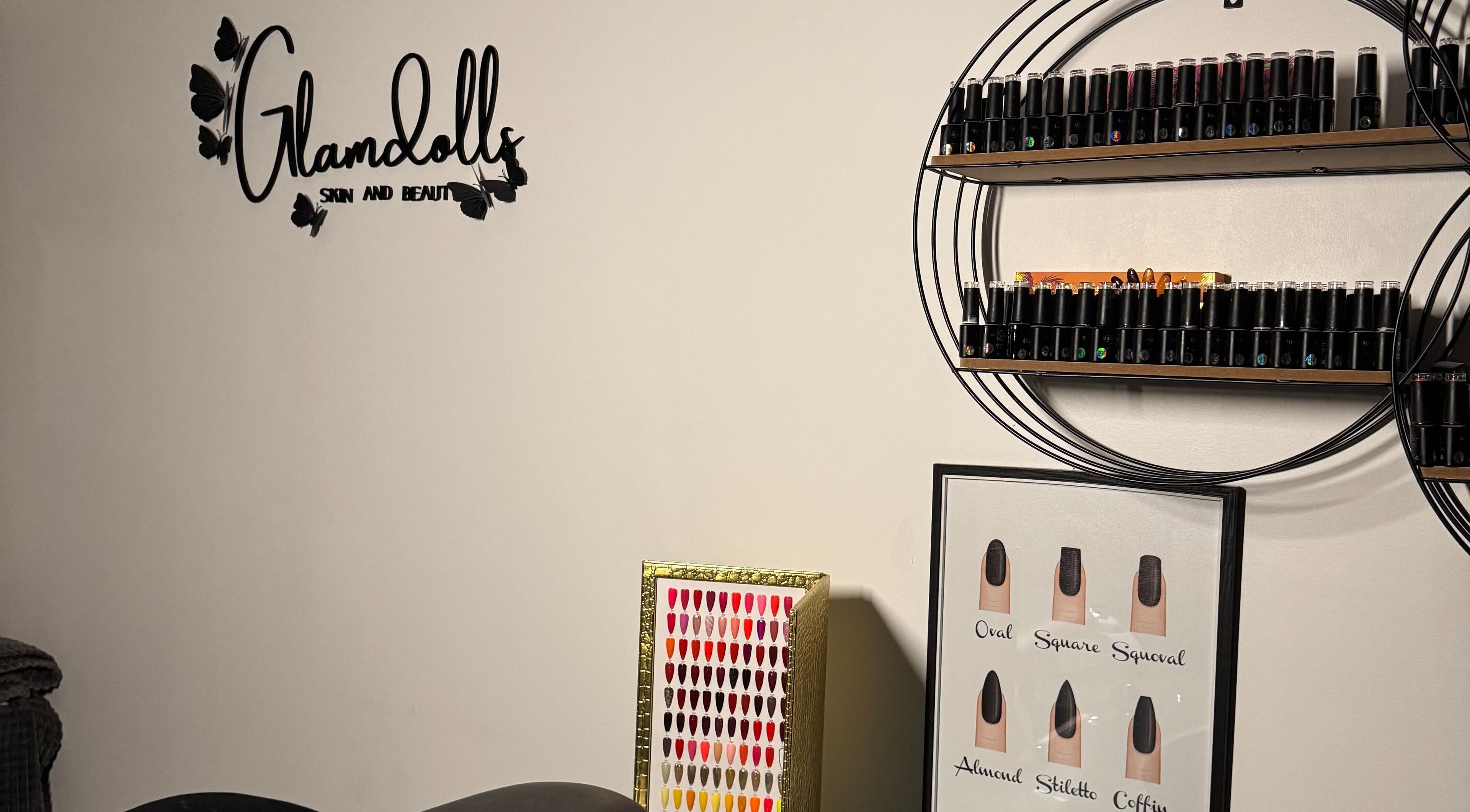 Glamdolls salon in Dublin, County Dublin, IE with nail polish display and logo on wall.