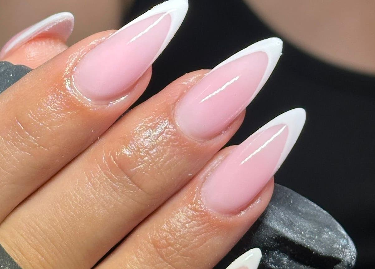 Elegant French tip nails at Glamdolls, Dublin, County Dublin, IE. Perfect for a sophisticated look.