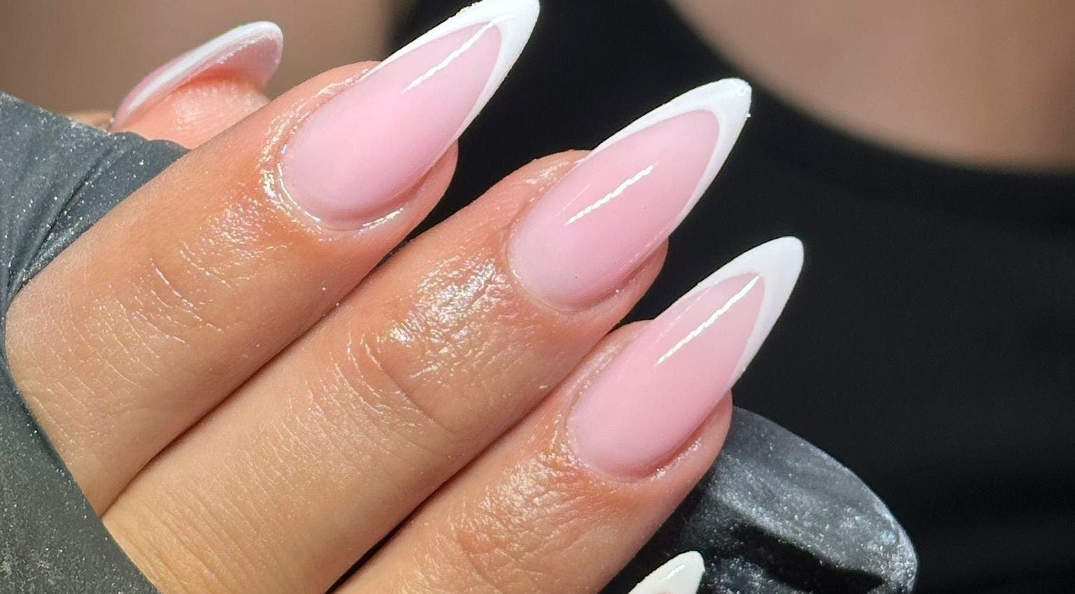 Elegant French tip nails at Glamdolls, Dublin, County Dublin, IE. Perfect for a sophisticated look.