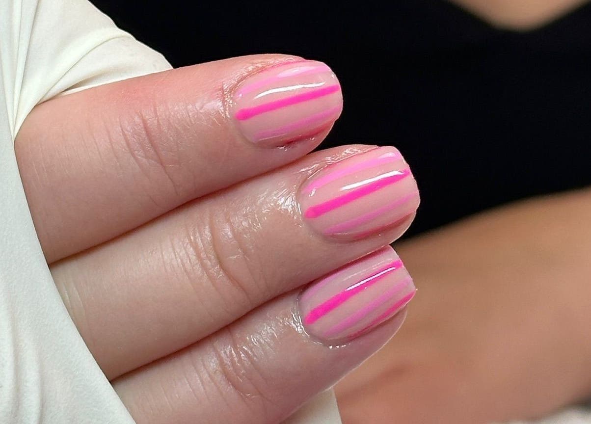 Elegant pink striped nails at Glamdolls, Dublin, County Dublin, IE. Perfect manicure for stylish looks.
