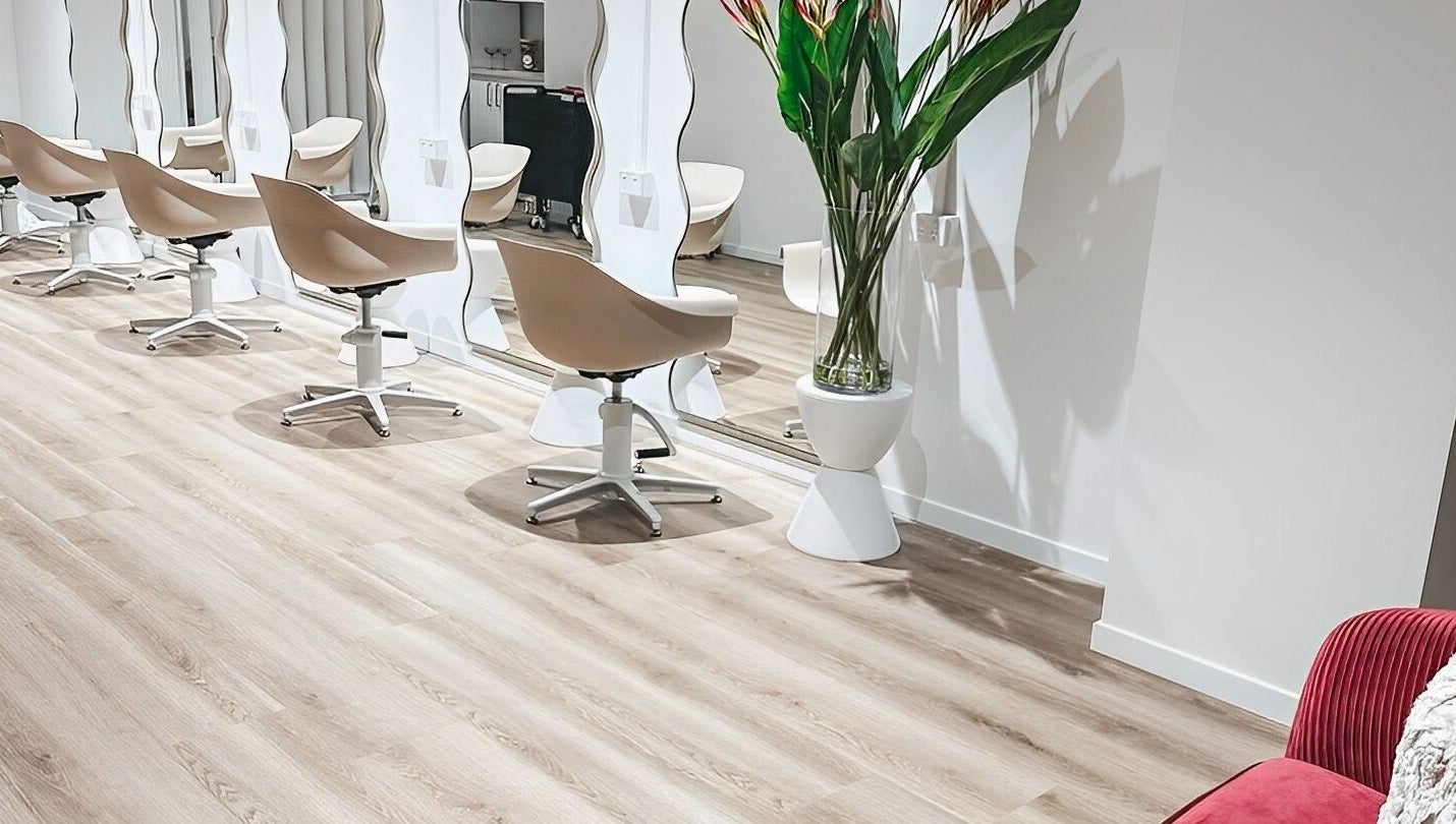 Interior of Blondelicious salon at Palm Cove, Queensland, AU showcasing modern chairs and mirrors.
