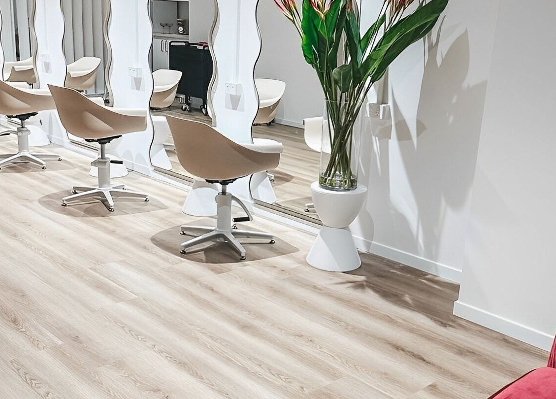 Interior of Blondelicious salon at Palm Cove, Queensland, AU showcasing modern chairs and mirrors.